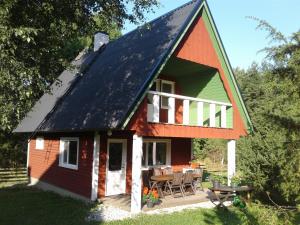 a small house with a gambrel roof at Holiday Home with Sauna in Kassari