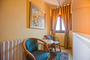 Postel nebo postele na pokoji v ubytování Hotel Elimo