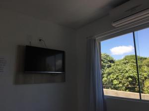 TV a/nebo společenská místnost v ubytování Residencial Neto