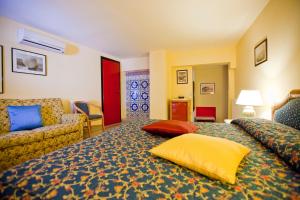 Postel nebo postele na pokoji v ubytování Hotel Elimo