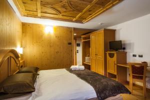 Postel nebo postele na pokoji v ubytování Hotel Pedranzini