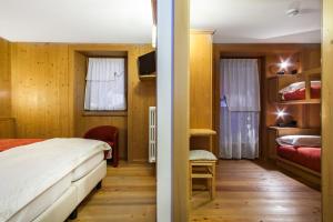 Postel nebo postele na pokoji v ubytování Hotel Pedranzini