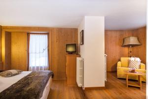 Postel nebo postele na pokoji v ubytování Hotel Pedranzini