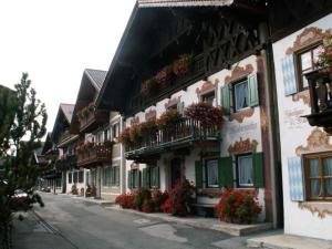 a row of buildings with flower boxes on the balconies at Fewo Königsberger in Garmisch-Partenkirchen