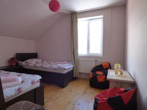 Ένα ή περισσότερα κρεβάτια σε δωμάτιο στο Anano Guest House