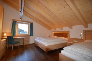 Postel nebo postele na pokoji v ubytování Apartments & Zimmer Urschnerhof
