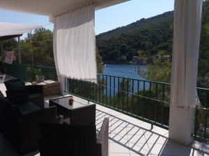 a balcony with a view of a body of water at Apartment Nono Ivo in Vis