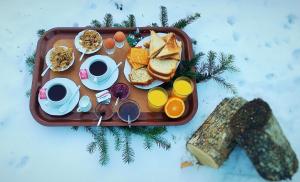a tray of breakfast food with eggs and toast at Kato Machalas in Dikoryfo +54 photos
