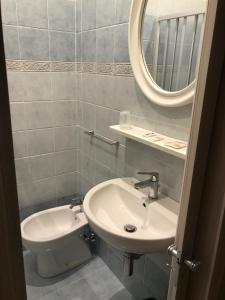 Koupelna v ubytování Hotel Amica