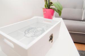 a white side table with a potted plant on it at Los Rodeos Luxury Vivienda Vacacional in La Laguna