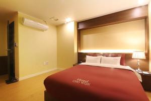 Postel nebo postele na pokoji v ubytování Hotel Chowon