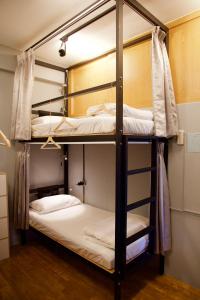 a couple of bunk beds in a room at Stay Liuqiu Diving Hostel in Xiaoliuqiu