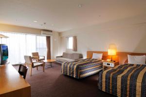 เตียงในห้องที่ Wisterian Life Club Usami