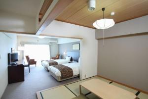 เตียงในห้องที่ Wisterian Life Club Usami