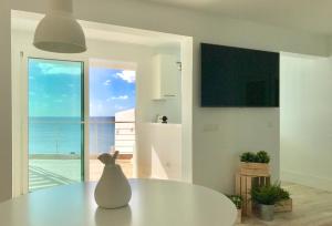 a white vase sitting on a table in a room at Casa Atlantica in Las Playas