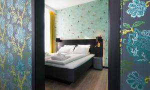 Postel nebo postele na pokoji v ubytování Thon Hotel Arena