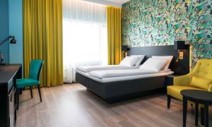 Postel nebo postele na pokoji v ubytování Thon Hotel Arena