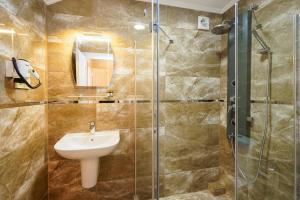 a bathroom with a sink and a shower at Authentic Apartments OldCity in Istanbul +42 photos