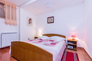 Postel nebo postele na pokoji v ubytování Apartments Silvana 1183 + 49 fotografií