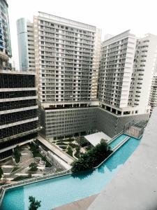 arial view of a building with a swimming pool at KL Gateway Residency in Kuala Lumpur