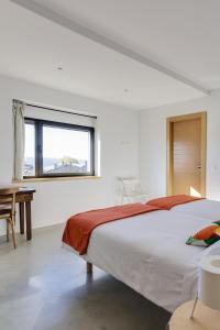A bed or beds in a room at Casa la Devesa de Sanabria