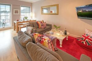 a living room with a couch and a table at The Square in Kelso