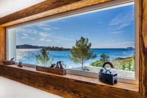 a window with a view of the ocean at Villa Soleil in Vela Luka