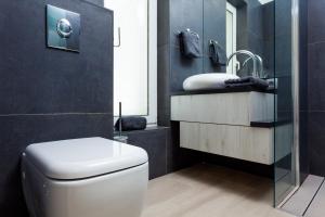 a bathroom with a toilet and a sink at Villa Soleil in Vela Luka