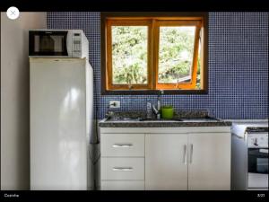 Una cocina o zona de cocina en Condominio Acquaville - Curral casa 2