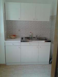 Kuchyňa alebo kuchynka v ubytovaní Apartments Dalmatino