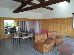 a living room with a couch and a table and chairs at loft At Besset in Besset