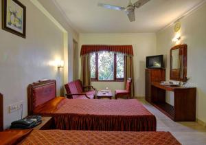 Een bed of bedden in een kamer bij Hotel Apex