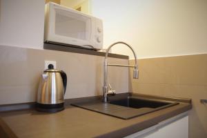 Kuchyň nebo kuchyňský kout v ubytování Apartament Aesthetic
