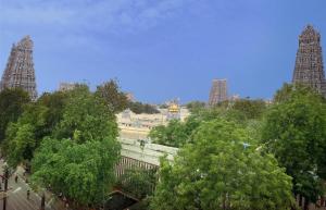 a view of a city with tall buildings and trees at Hotel Sabareesh Plaza in Madurai