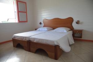 Postel nebo postele na pokoji v ubytování Résidence Clémentine Villa Passion