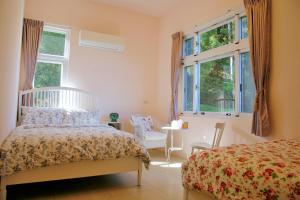 Postel nebo postele na pokoji v ubytování Yanzitao Pottery Coffee B&B