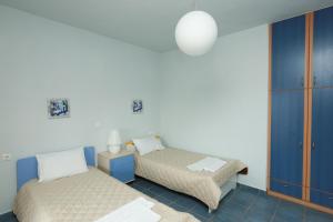 Postel nebo postele na pokoji v ubytování Villa Anemoessa + 15 fotografií