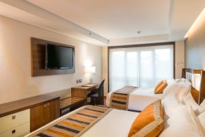 Postel nebo postele na pokoji v ubytování Hotel Dann Carlton Bogota