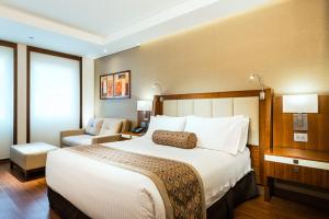 Postel nebo postele na pokoji v ubytování Hotel Dann Carlton Bogota