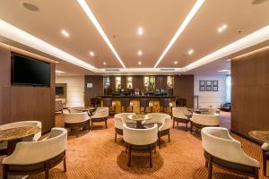 TV a/nebo společenská místnost v ubytování Hotel Dann Carlton Bogota