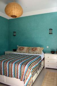 Кровать или кровати в номере Tifawin Apartment