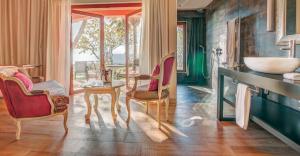 Uma área de estar em Boutique Hotel Vivenda Miranda