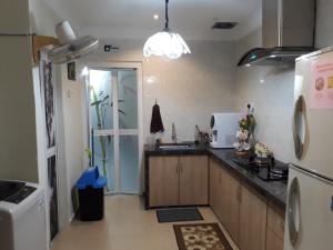 Virtuvė arba virtuvėlė apgyvendinimo įstaigoje SMART Homestay Permaipura