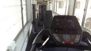 a gym in a bus with a treadmill at Parador de Alcalá de Henares in Alcalá de Henares