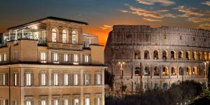 a building next to a building next to another building at Hotel Palazzo Manfredi – Small Luxury Hotels of the World in Rome