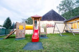 a childrens playground with a slide and a play structure at Winzerhof Dürauer in Furth