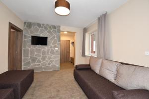 A television and/or entertainment centre at Hotel Studničky