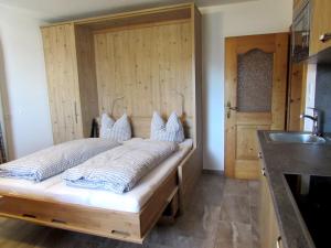 Uma cama ou camas num quarto em Studlerhof