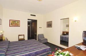 מיטה או מיטות בחדר ב-Park Hotel Galileo