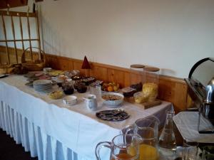 a table with food and drinks on top of it at Hotel zum goldenen Hirschen in Göstling an der Ybbs